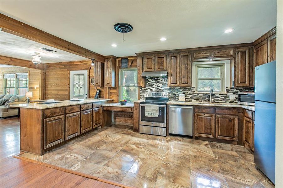 The spacious kitchen offers abundant cabinetry, generous counter space, and an open view of the main living areas. The spacious kitchen offers abundant cabinetry, generous counter space, and an open view of the main living areas.