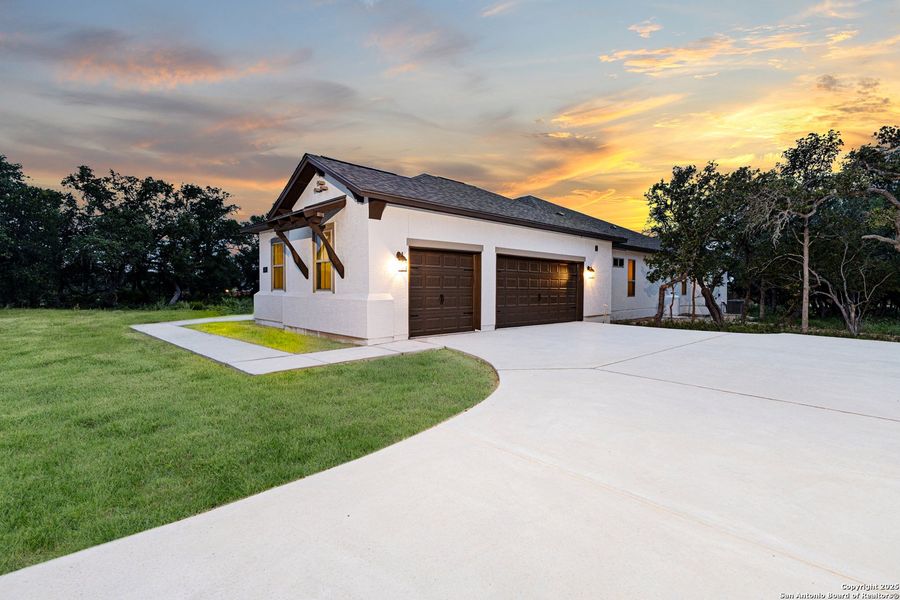 Front exterior of a new home in Potranco Acres, Castroville, TX, highlighting curb appeal (Image 23). Front exterior of a new home in Potranco Acres, Castroville, TX, highlighting curb appeal (Image 23).