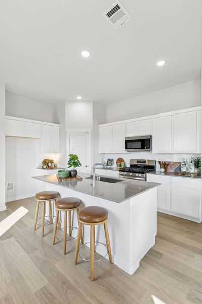 Kitchen in a Nicholson Ranch Magnolia Model Home in Lavon TX by Trophy Signature Homes
