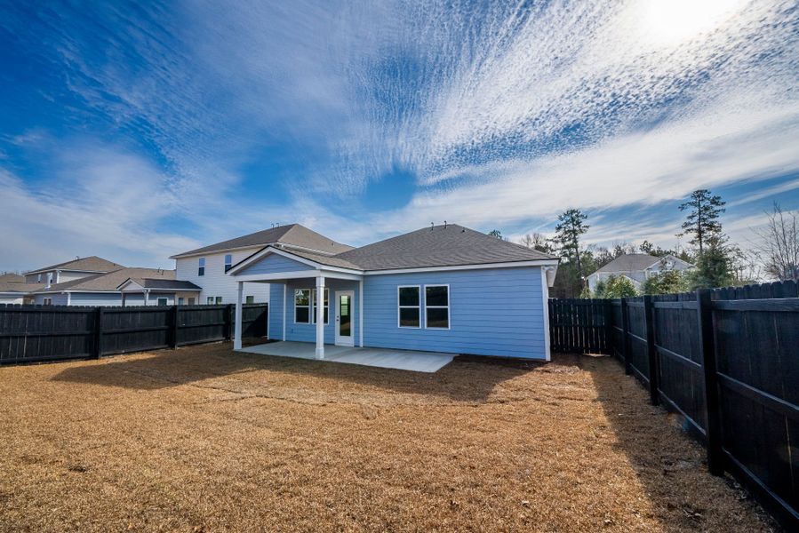 Exterior details and patio area of a home in Monroe Preserve, Chapin (Image 31).
