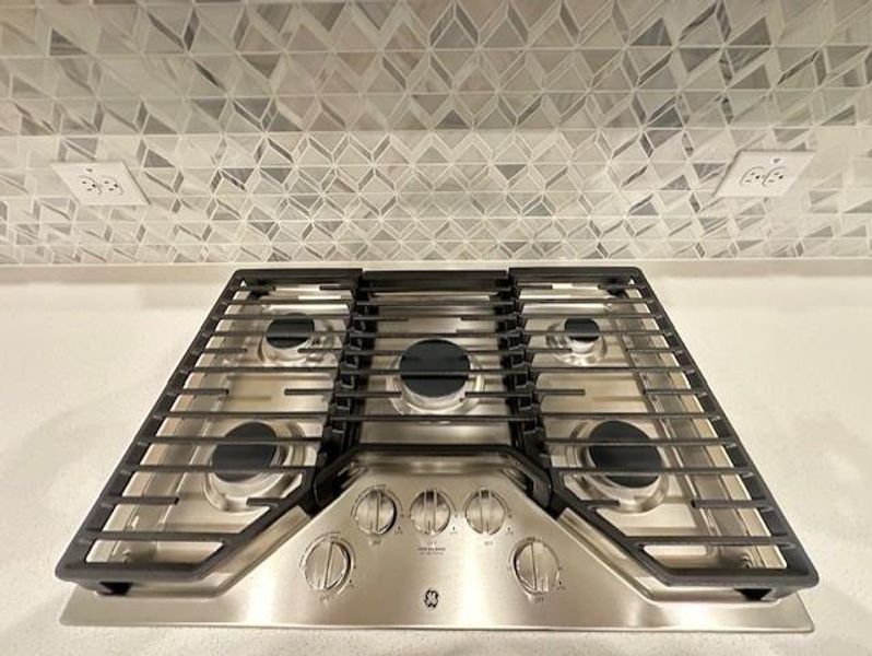 tuscan kitchen backsplash and stovetop