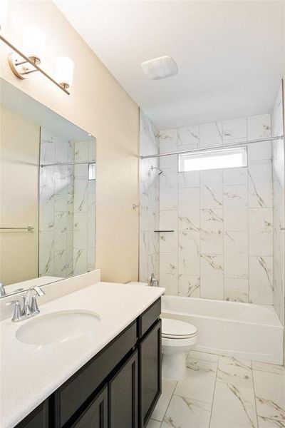 Bathroom with vanity, shower / bath combination