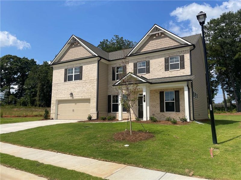 Front exterior of a new home in Summerlin, Winder, GA, highlighting curb appeal (Image 24).