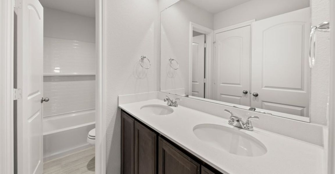 Representative exterior photo of a completed home built from the Raleigh by Impression Homes in Keeneland, Aubrey, TX (Image 16). Representative exterior photo of a completed home built from the Raleigh by Impression Homes in Keeneland, Aubrey, TX (Image 16).