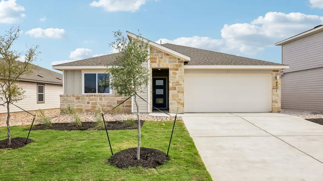 Front exterior of a new home in Trails at Wildhorse, Austin, TX, highlighting curb appeal (Image 2). Front exterior of a new home in Trails at Wildhorse, Austin, TX, highlighting curb appeal (Image 2).