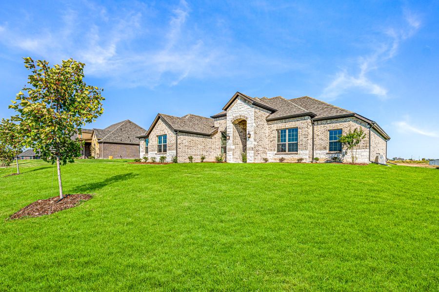 Front exterior of a new home in Creekview Farms, Greenville, TX, highlighting curb appeal (Image 25).