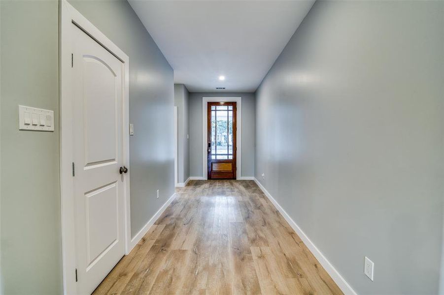 Doorway to outside featuring light wood-type flooring