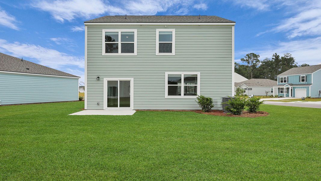 Front exterior of a new home in Hillcrest, Ravenel, SC, highlighting curb appeal (Image 20). Front exterior of a new home in Hillcrest, Ravenel, SC, highlighting curb appeal (Image 20).