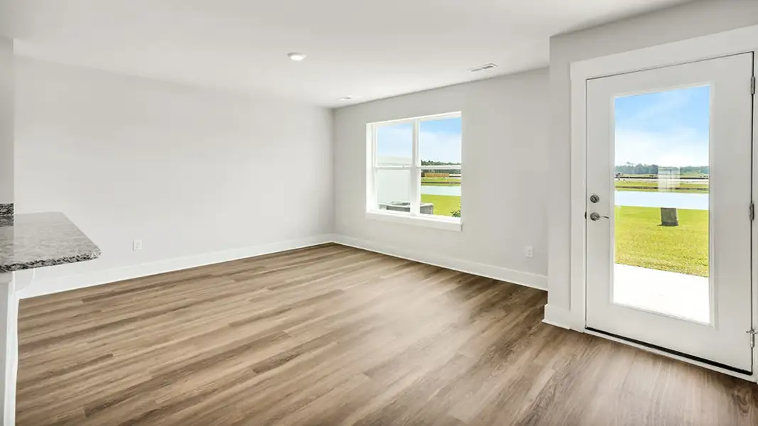 Spacious, unfurnished interior of a new home in The Cove at Indigo Preserve Townhomes, Leland (Image 9).
