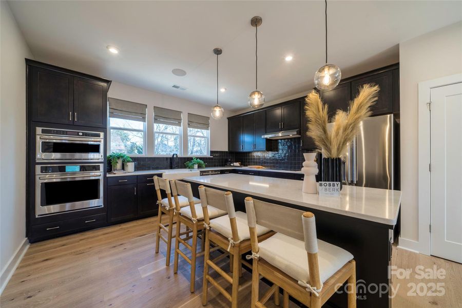 Gourmet Kitchen Layout with Convenient Storage Solutions. Gourmet Kitchen Layout with Convenient Storage Solutions.