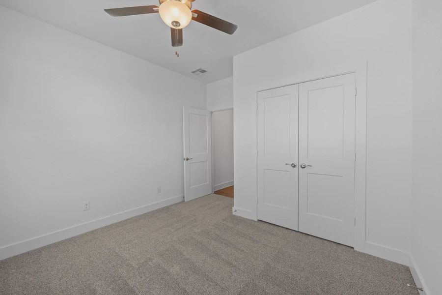 Representative unfurnished interior of a home built from the Carriagehouse by Chesmar Homes in Meridiana Townhomes, Iowa Colony (Image 79).