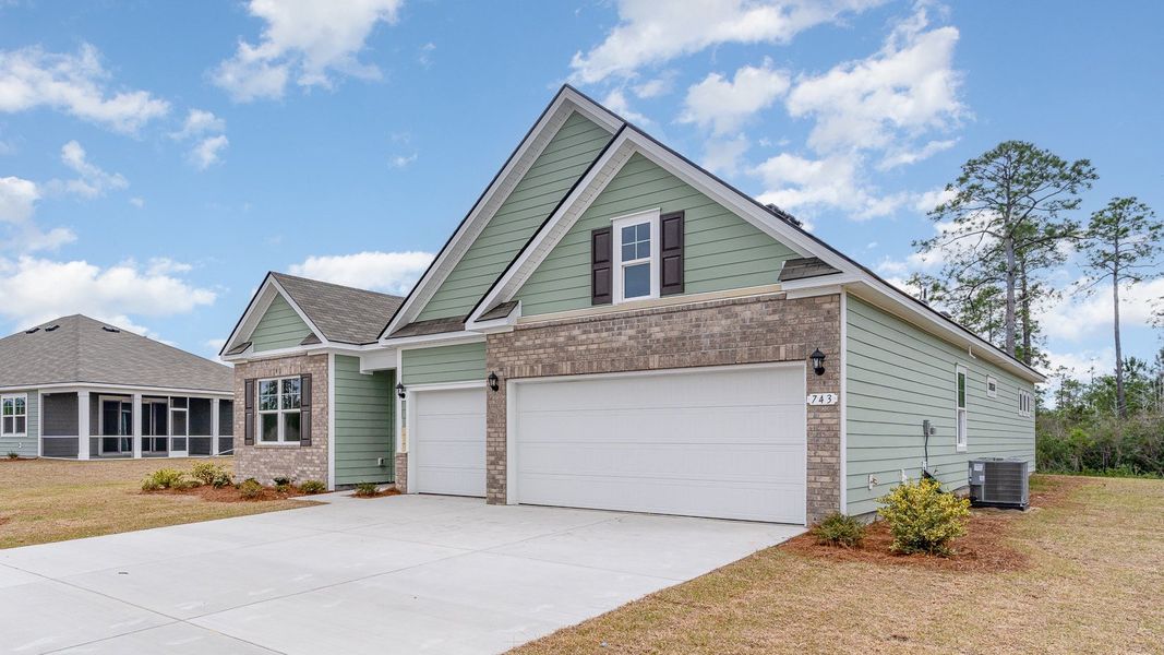 Front exterior of a new home in Auberon Woods, Conway, SC, highlighting curb appeal (Image 2). Front exterior of a new home in Auberon Woods, Conway, SC, highlighting curb appeal (Image 2).