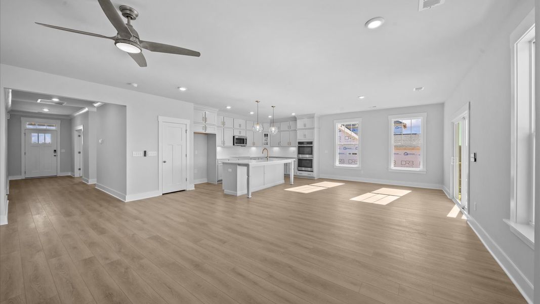 Memorable moments begin in this elegant, open family room with hardwood flooring and refined finishes