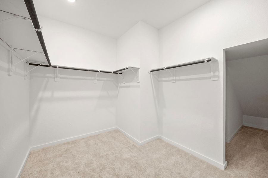 The master closet is large with plenty of opportunity to add more shelving and a second rack around the top. You also have another section to the right to add more storage.