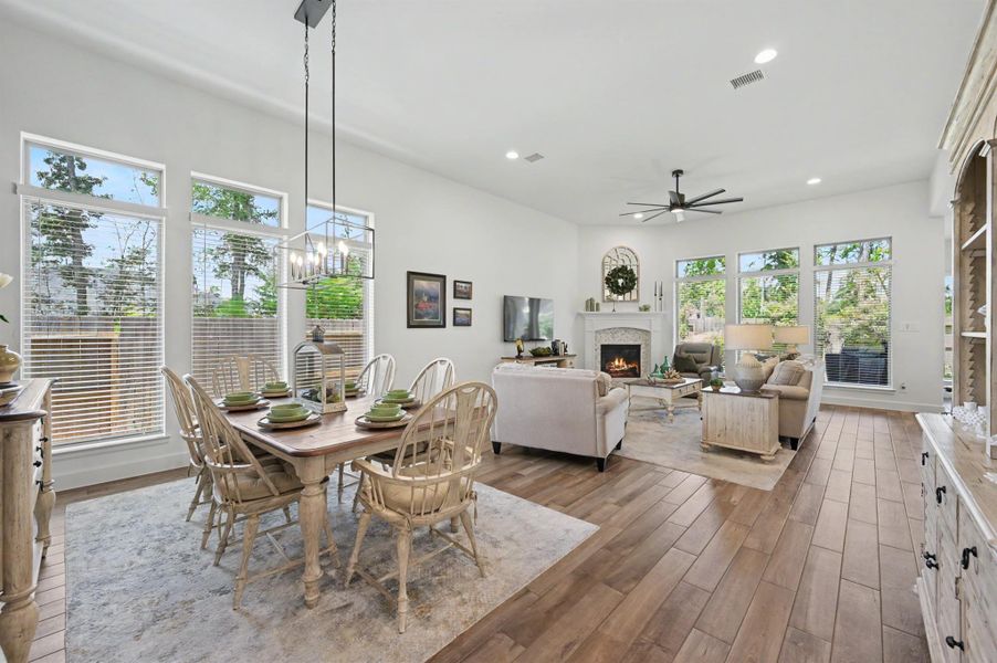 As you leave the secondary living area of the home, you enter this open gathering space filled with light. There is a designated formal dining area which is open to the family room. All with views to the outside. As you leave the secondary living area of the home, you enter this open gathering space filled with light. There is a designated formal dining area which is open to the family room. All with views to the outside.