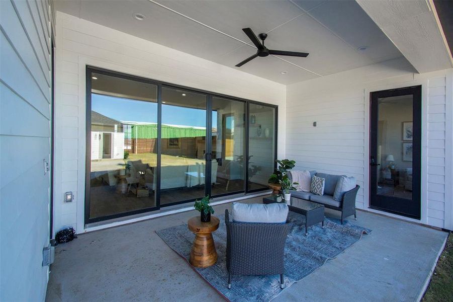 View of patio / terrace with an outdoor hangout area and ceiling fan