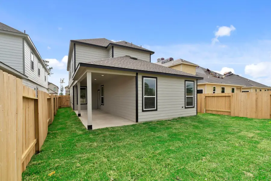 Exterior details and patio area of a home in Cypresswood Landing, Humble (Image 3).