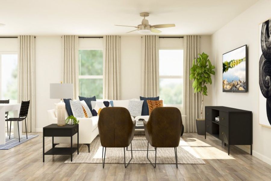 A living room with a large window. A living room with a large window.