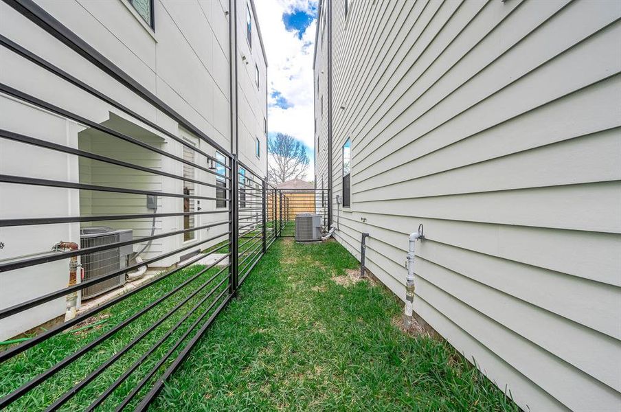 Fully gated outdoor space in the back of the home.