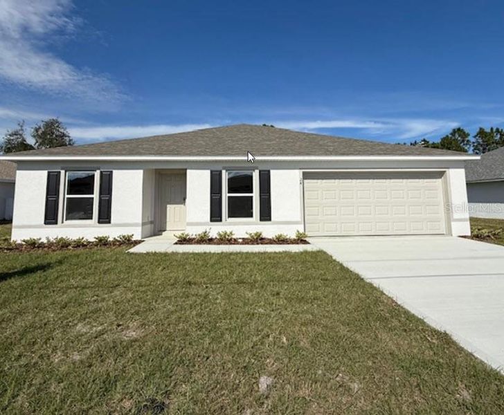 Front exterior of a new home in Palm Coast: Value Collection, Palm Coast, FL, highlighting curb appeal (Image 1).