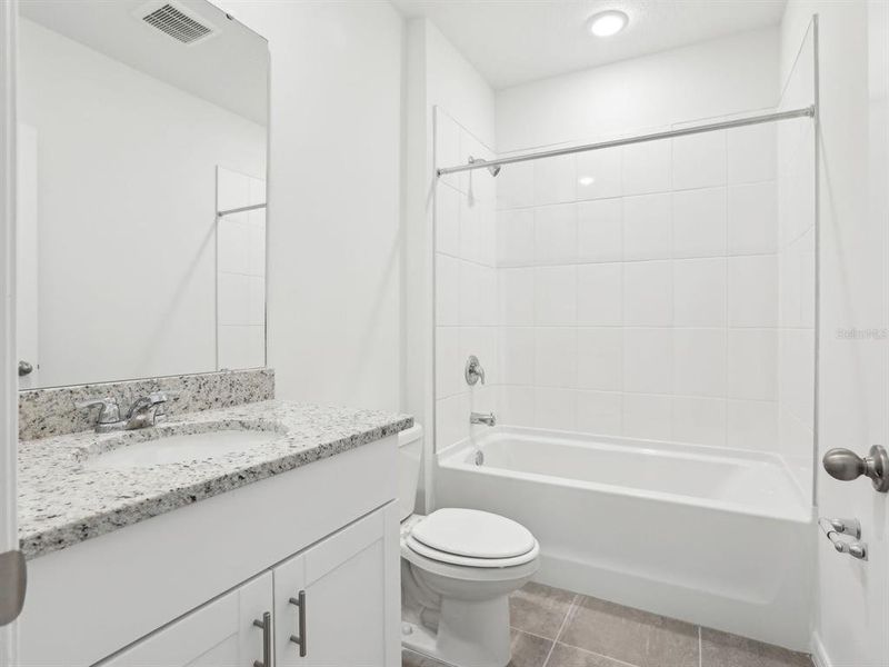 Furnished interior view inside a new home in The Reserve at Van Oaks, Auburndale (Image 6).