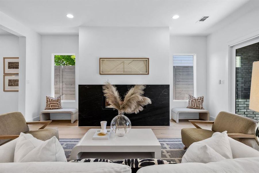 Living room with light hardwood / wood-style floors