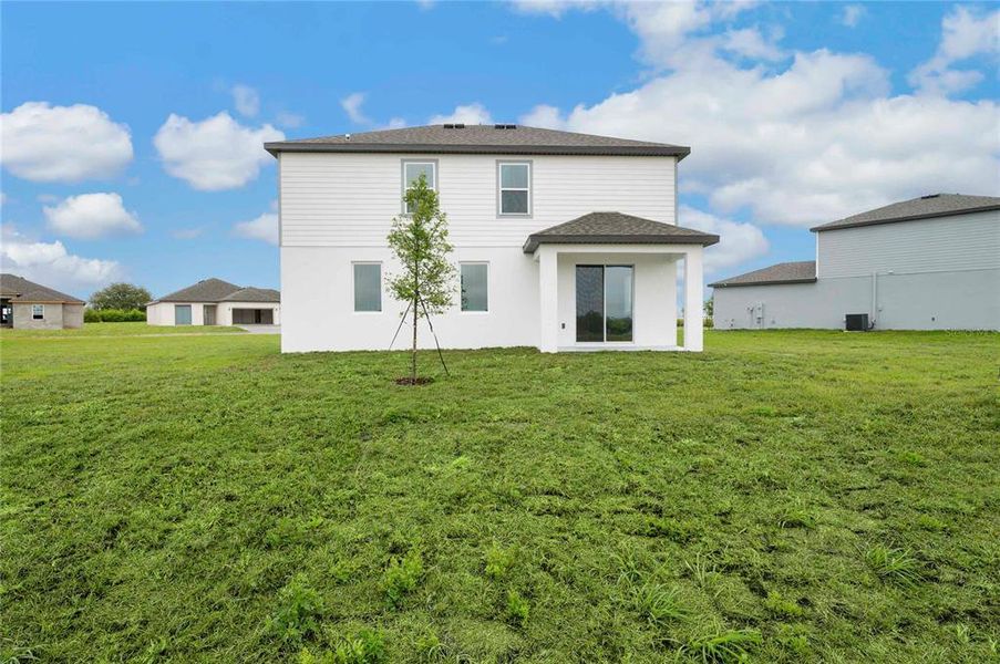 Exterior details and patio area of a home in Citrus Place, Babson Park (Image 4).