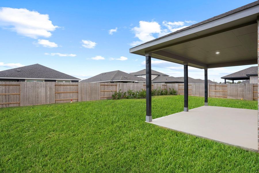 The extended patio provides plenty of space for entertaining family and friends, with room for a grill, outdoor seating, and more.