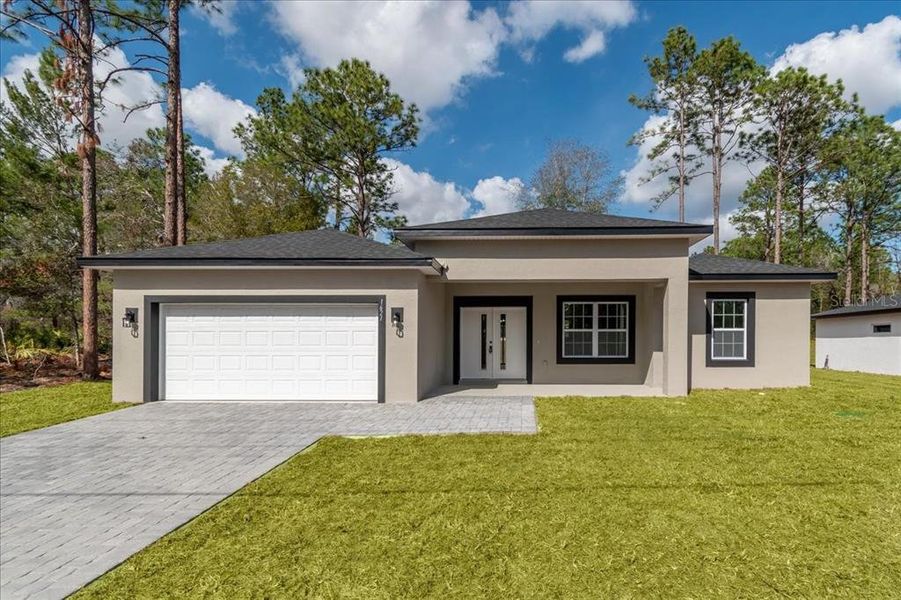 Front exterior of a new home in , Citrus Springs, FL, highlighting curb appeal (Image 2).