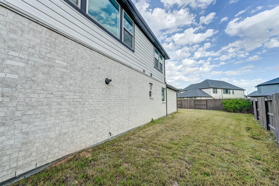Exterior details and patio area of a home in , Cypress (Image 3).