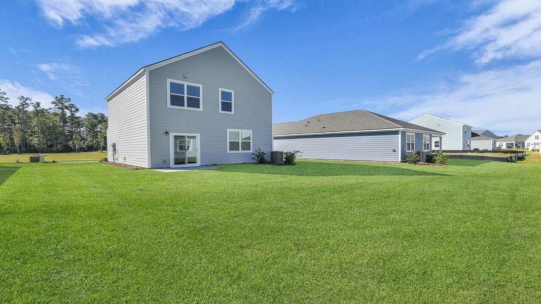 Exterior details and patio area of a home in Hillcrest, Ravenel (Image 3). Exterior details and patio area of a home in Hillcrest, Ravenel (Image 3).