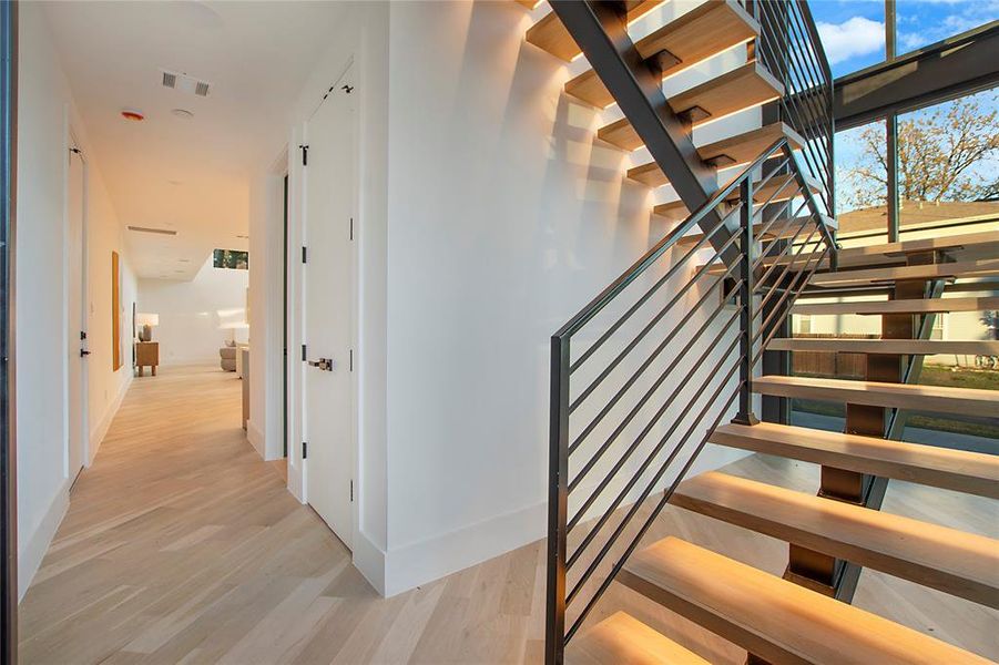 Stairs with hardwood / wood-style flooring