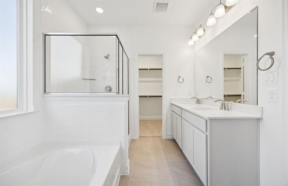 Owner's bath designed with a double vanity