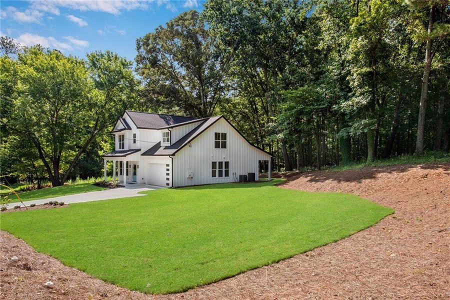 Front exterior of a new home in , Dallas, GA, highlighting curb appeal (Image 2). Front exterior of a new home in , Dallas, GA, highlighting curb appeal (Image 2).
