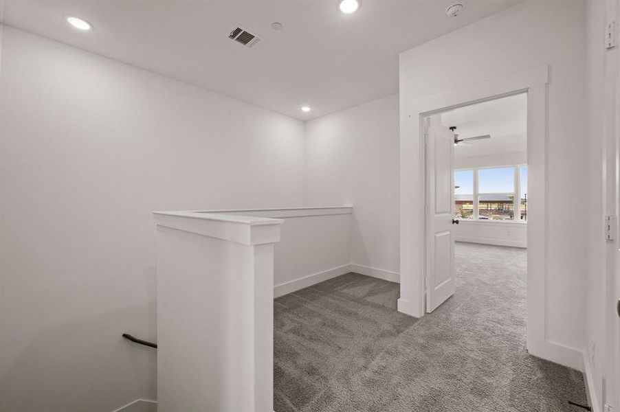 The loft at the top of the stairs makes a perfect pocket office or reading nook.