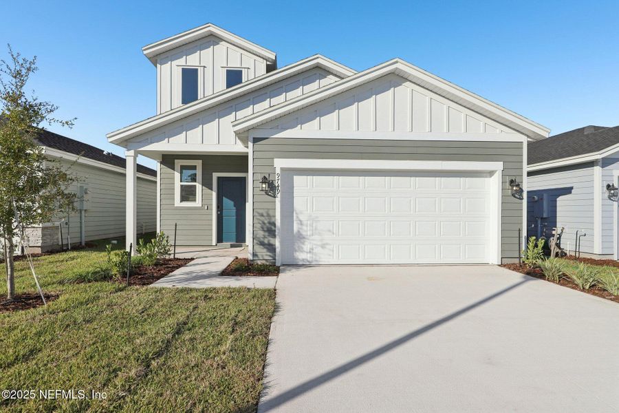 Front exterior of a new home in Cypress Meadows - Classic Series, Jacksonville, FL, highlighting curb appeal (Image 1).