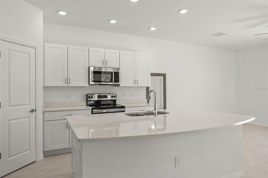 Furnished interior view inside a new home in , Kissimmee (Image 4). Furnished interior view inside a new home in , Kissimmee (Image 4).