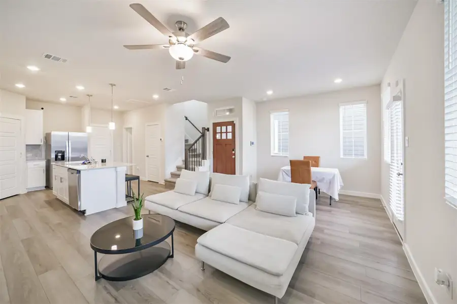 The living room, dining room and kitchen flow seamlessly. The living room, dining room and kitchen flow seamlessly.