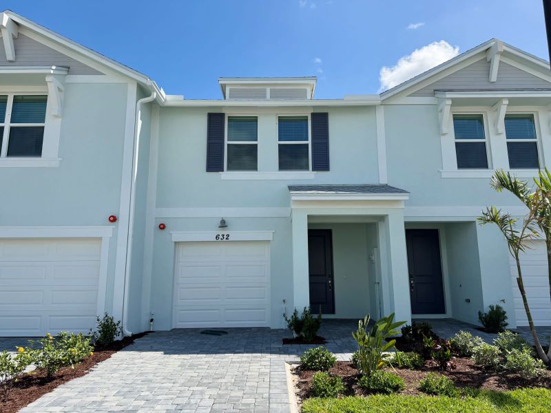 Front exterior of a new home in Tidewater, Fort Pierce, FL, highlighting curb appeal (Image 1). Front exterior of a new home in Tidewater, Fort Pierce, FL, highlighting curb appeal (Image 1).