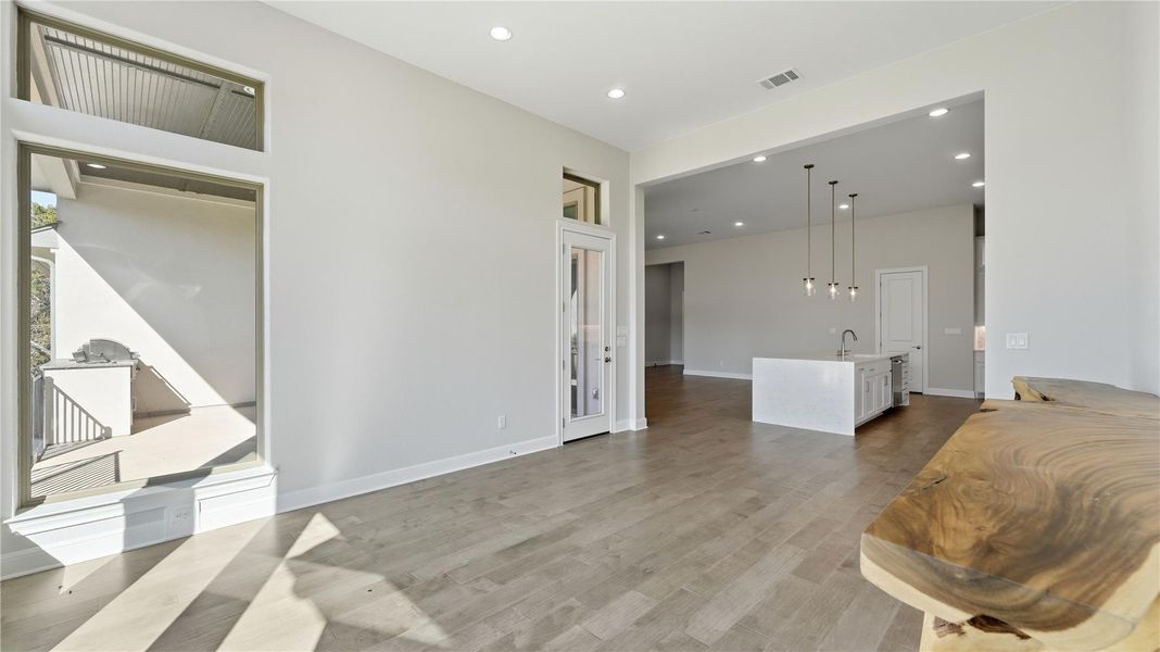 Living area featuring recessed lighting and light wood-style floors Living area featuring recessed lighting and light wood-style floors