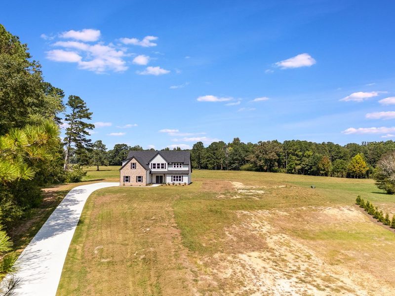 Front exterior of a new home in LOVVORN ESTATES, Carrollton, GA, highlighting curb appeal (Image 2).