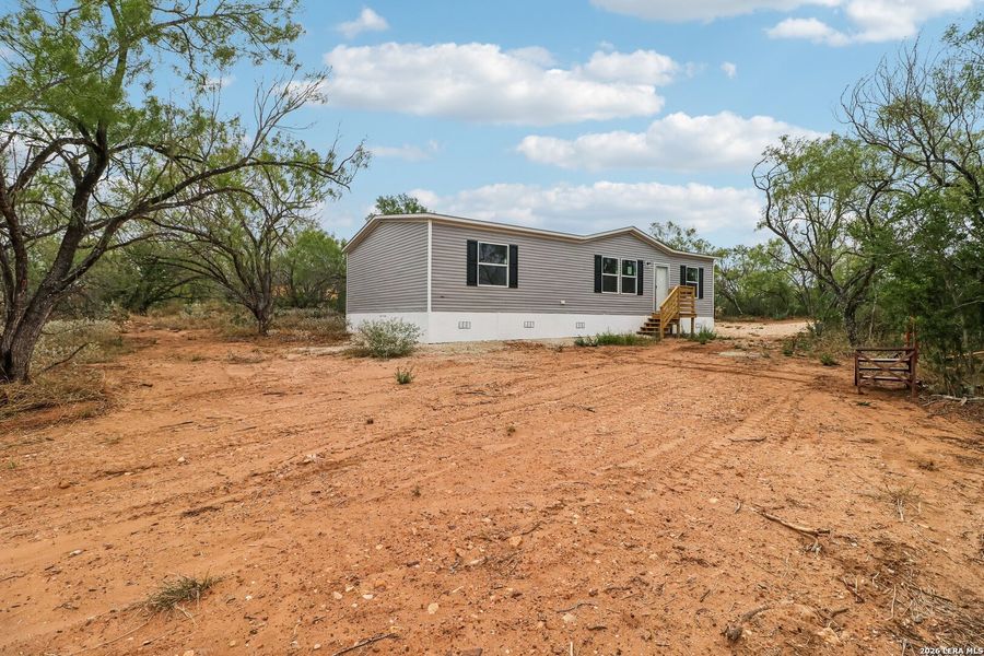 Exterior details and patio area of a home in , Devine (Image 23). Exterior details and patio area of a home in , Devine (Image 23).