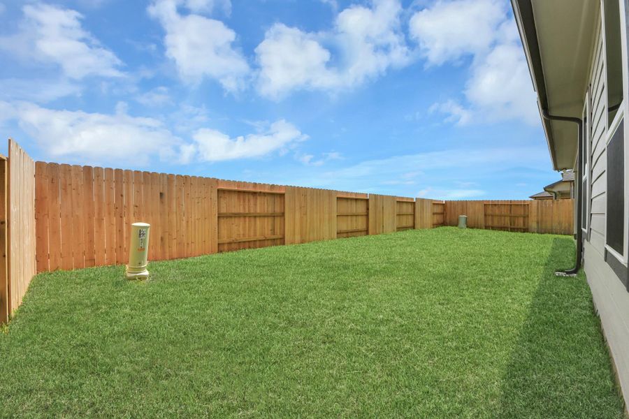 Backyard retreat, offering an abundance of space for kids to play and explore. The possibilities are endless in this outdoor haven, where the joy of open-air activities and family gatherings awaits. Backyard retreat, offering an abundance of space for kids to play and explore. The possibilities are endless in this outdoor haven, where the joy of open-air activities and family gatherings awaits.