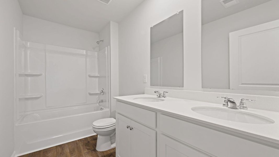 Furnished interior view inside a new home in Pine Hills at Cane Bay, Summerville (Image 11). Furnished interior view inside a new home in Pine Hills at Cane Bay, Summerville (Image 11).