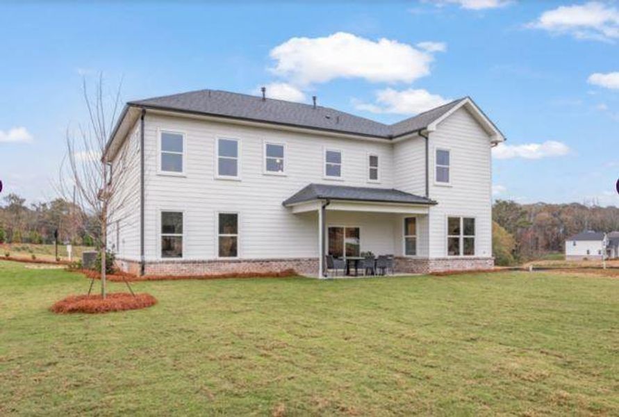 Front exterior of a new home in The Estates at Gainesville Township, Gainesville, GA, highlighting curb appeal (Image 2).