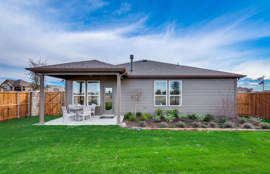 Spacious, fenced-in backyard with covered patio