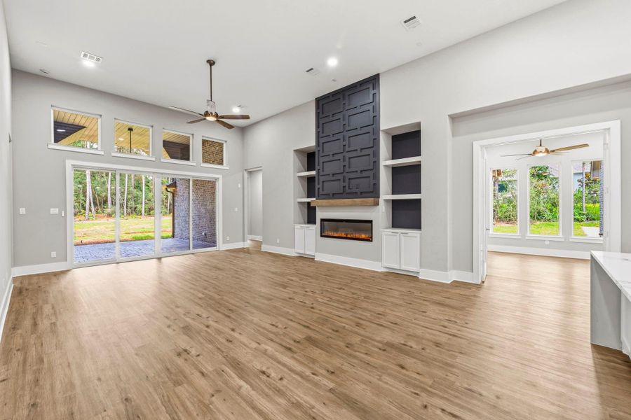 Soaring ceilings and abundant windows create an airy, light filled living space.