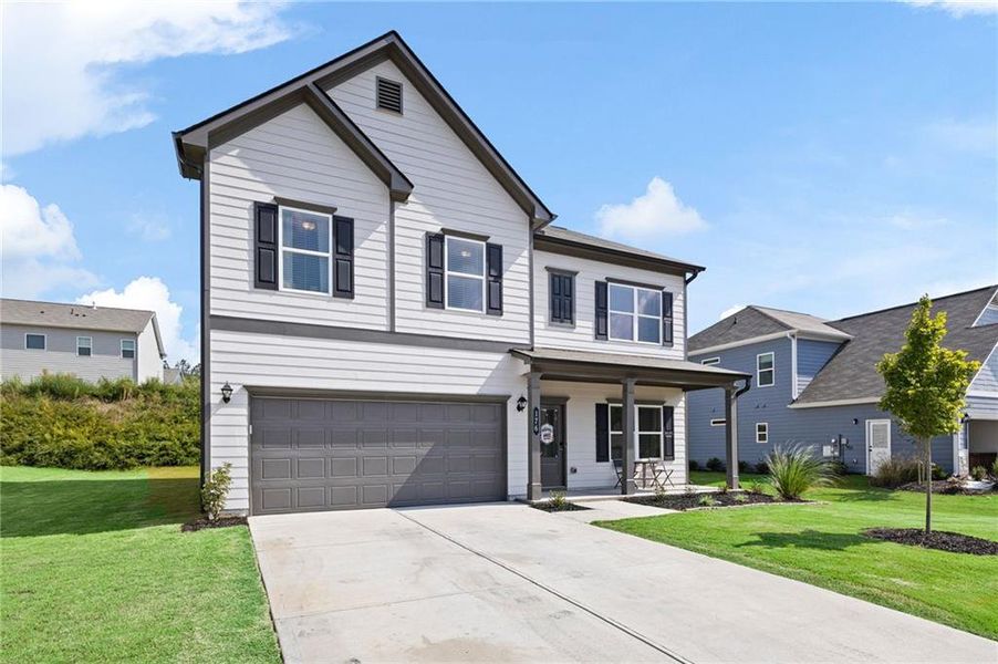 Front exterior of a new home in , Dallas, GA, highlighting curb appeal (Image 1).