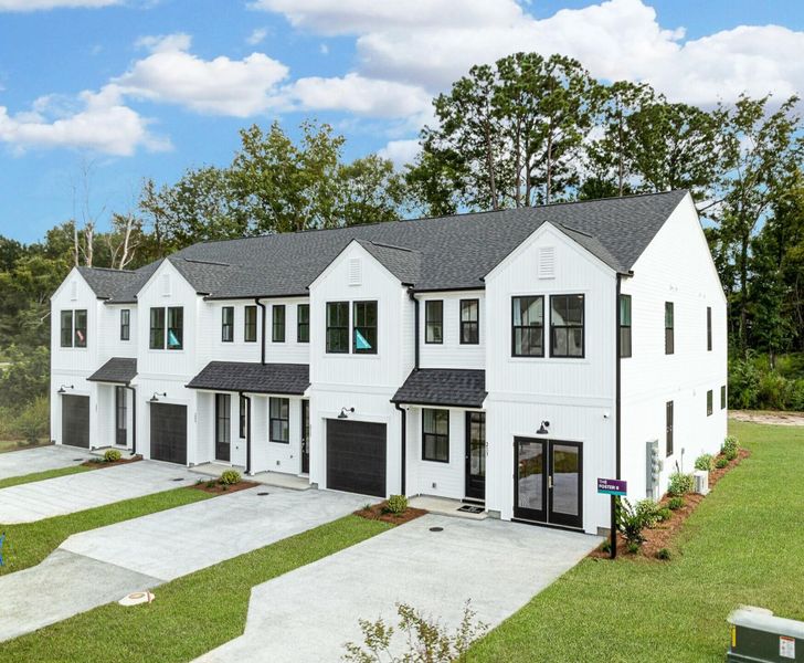 Front exterior of a new home in Windward Townes, Goose Creek, SC, highlighting curb appeal (Image 1). Front exterior of a new home in Windward Townes, Goose Creek, SC, highlighting curb appeal (Image 1).