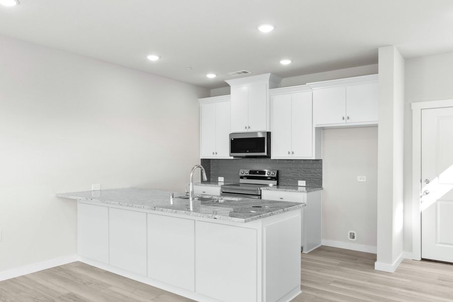 Furnished interior view inside a new home in Wildridge, Oak Point (Image 6).
